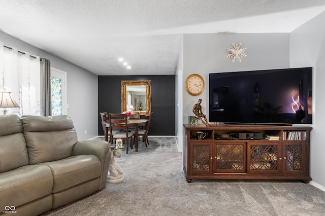 carpeted living room with a textured ceiling and baseboards