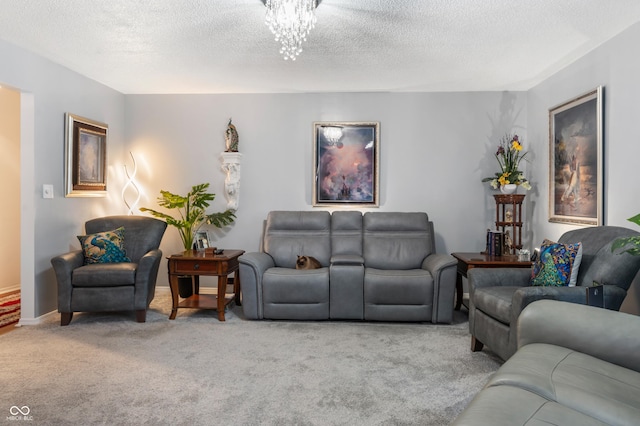 living room featuring baseboards, carpet, an inviting chandelier, and a textured ceiling