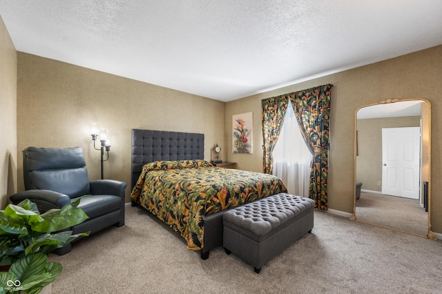 carpeted bedroom with baseboards, arched walkways, and a textured ceiling