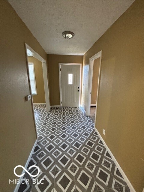 3302 E 42nd St, Indianapolis, IN 46205 - hallway with baseboards and a textured ceiling