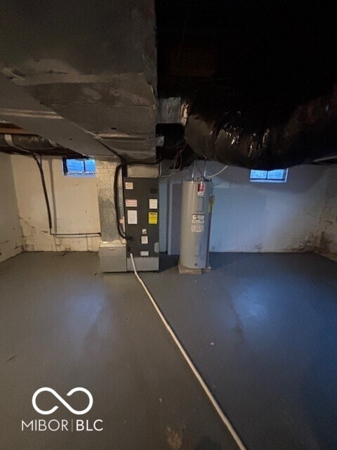 3302 E 42nd St, Indianapolis, IN 46205 - unfinished basement featuring heating unit and water heater
