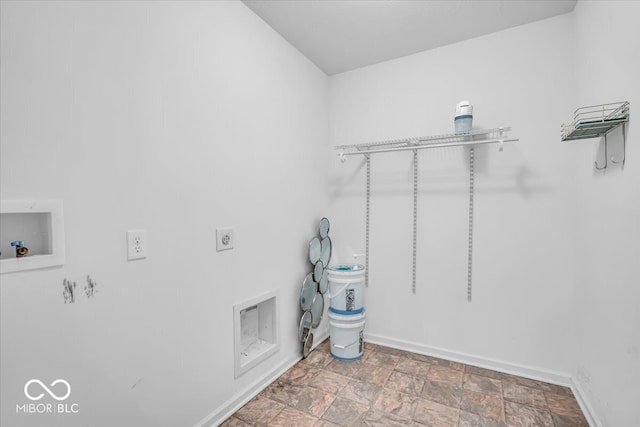 laundry room featuring stone finish flooring, baseboards, laundry area, hookup for a washing machine, and hookup for an electric dryer