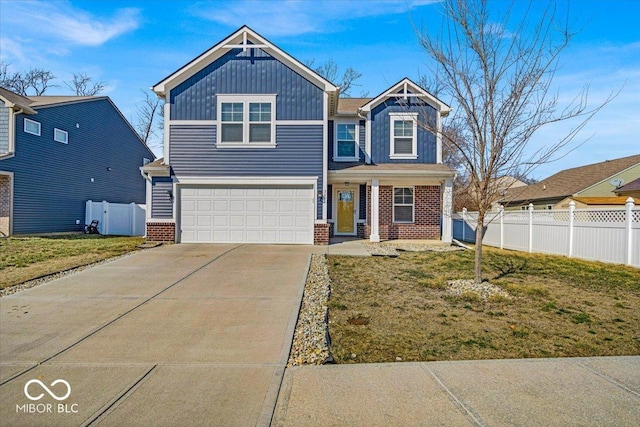 craftsman house with brick siding, board and batten siding, fence, concrete driveway, and a garage