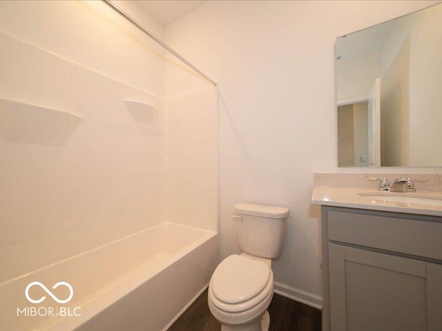 2254 Oakmont Dr, Plainfield, IN 46168 - bathroom with vanity, toilet, baseboards, and shower / bath combination