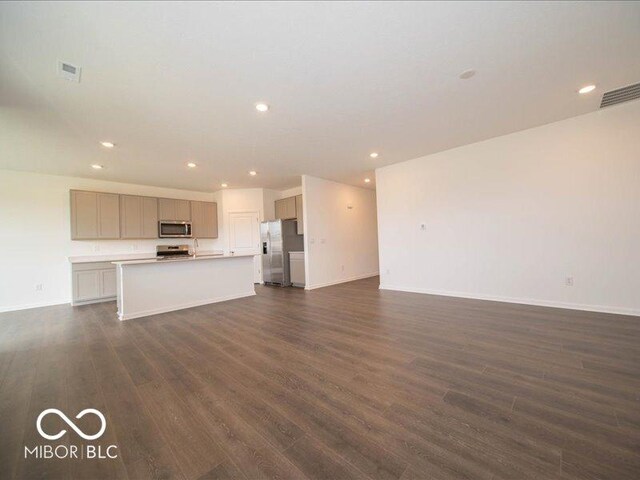 2254 Oakmont Dr, Plainfield, IN 46168 - unfurnished living room with dark wood-type flooring, recessed lighting, and baseboards