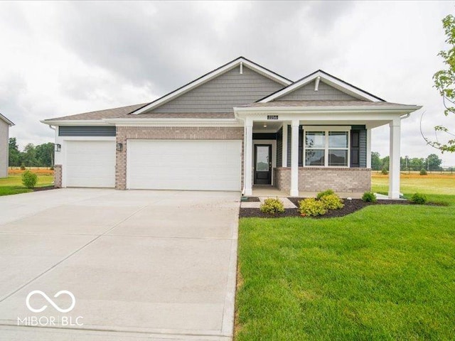 2254 Oakmont Dr, Plainfield, IN 46168 - craftsman inspired home featuring a front lawn, brick siding, concrete driveway, an attached garage, and a porch
