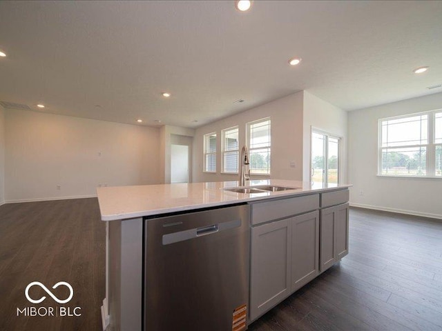 2254 Oakmont Dr, Plainfield, IN 46168 - kitchen with dishwasher, a sink, open floor plan, an island with sink, and light countertops