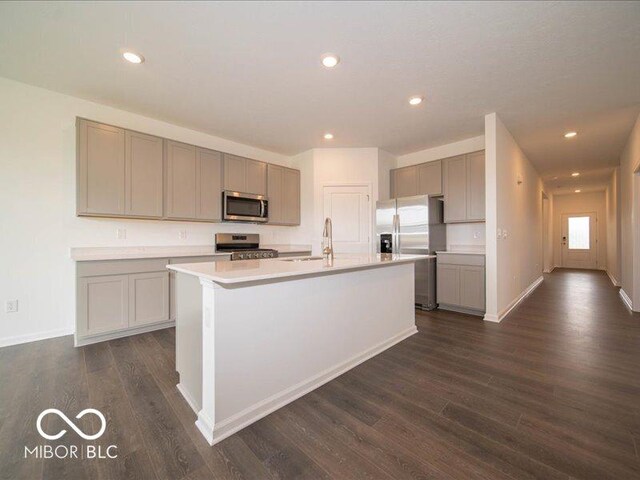 2254 Oakmont Dr, Plainfield, IN 46168 - kitchen with stainless steel appliances, gray cabinetry, a sink, dark wood-style floors, and light countertops