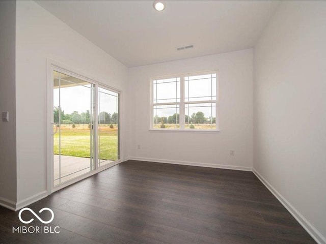 2254 Oakmont Dr, Plainfield, IN 46168 - spare room with healthy amount of natural light, dark wood-style flooring, and baseboards