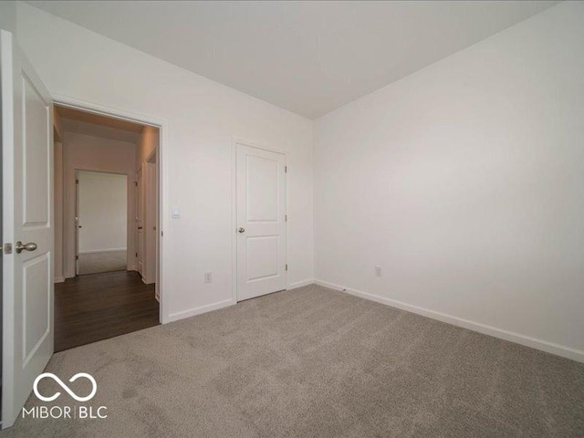 2254 Oakmont Dr, Plainfield, IN 46168 - unfurnished bedroom featuring carpet floors and baseboards