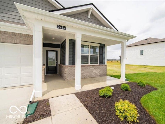 2254 Oakmont Dr, Plainfield, IN 46168 - entrance to property featuring a porch, brick siding, and a lawn