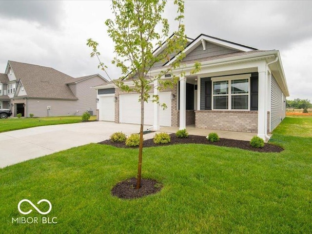 2254 Oakmont Dr, Plainfield, IN 46168 - view of front of home with concrete driveway, brick siding, a front yard, a garage, and covered porch