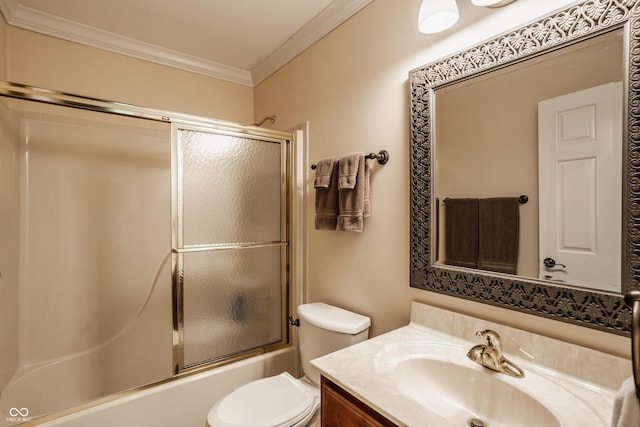 full bathroom with vanity, crown molding, toilet, and enclosed tub / shower combo