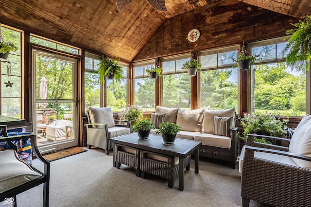 sunroom featuring a wealth of natural light, wood ceiling, lofted ceiling, and ceiling fan