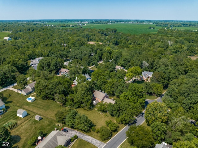 bird's eye view featuring a wooded view