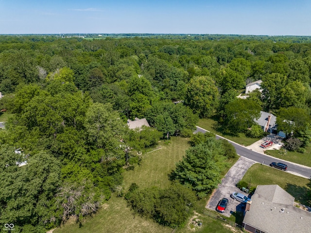 bird's eye view featuring a forest view