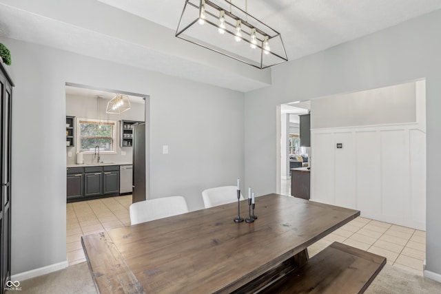 dining room featuring light tile patterned flooring and a notable chandelier