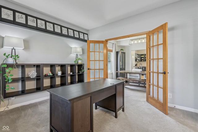 home office featuring baseboards, light colored carpet, and french doors