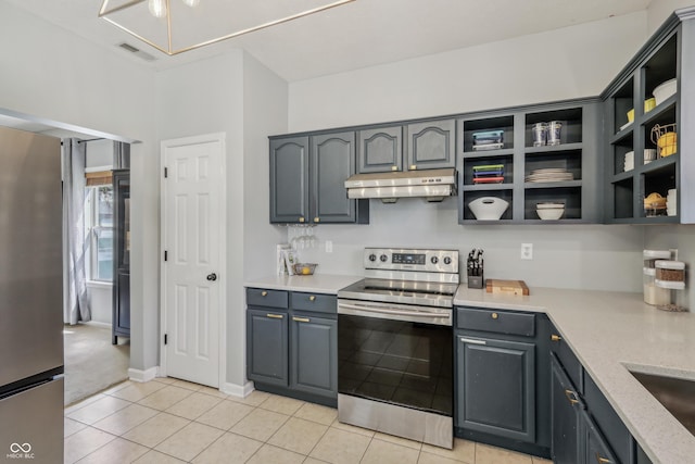 kitchen with visible vents, open shelves, under cabinet range hood, light tile patterned floors, and stainless steel appliances
