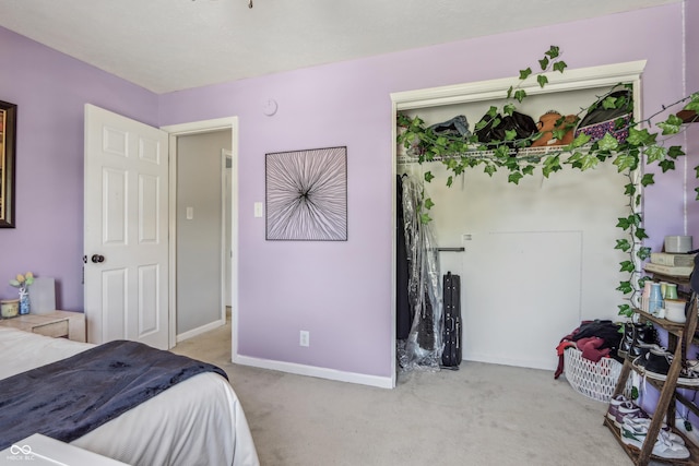 bedroom featuring carpet floors and baseboards