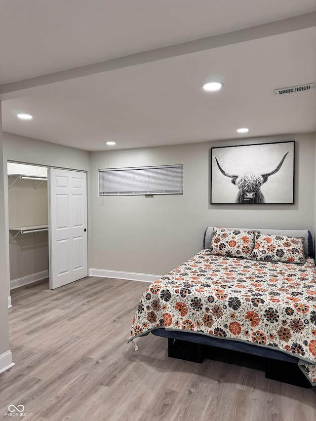 bedroom with visible vents, recessed lighting, wood finished floors, and baseboards