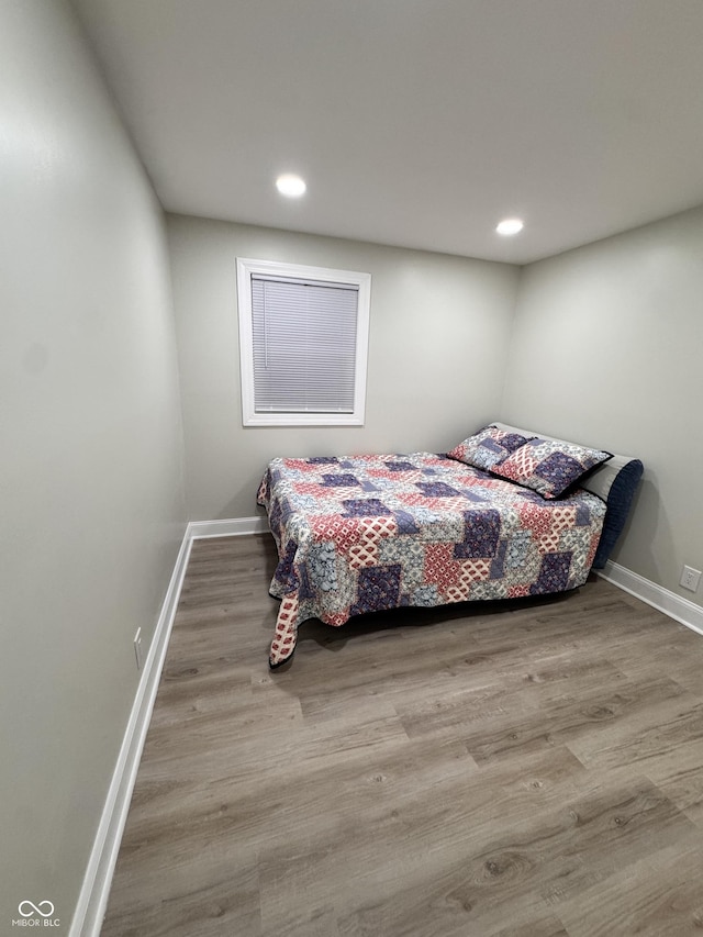 bedroom featuring recessed lighting, baseboards, and wood finished floors