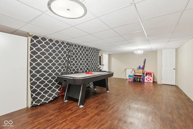 playroom featuring wood finished floors and a drop ceiling