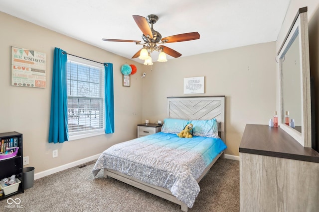 carpeted bedroom featuring visible vents, a ceiling fan, and baseboards