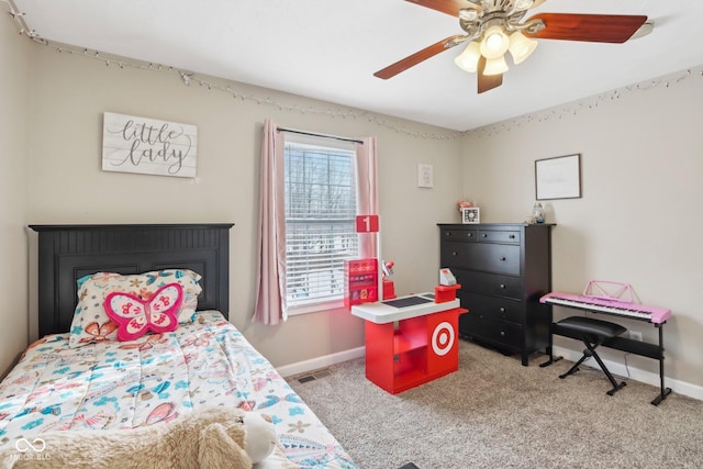 bedroom featuring baseboards, light carpet, and a ceiling fan