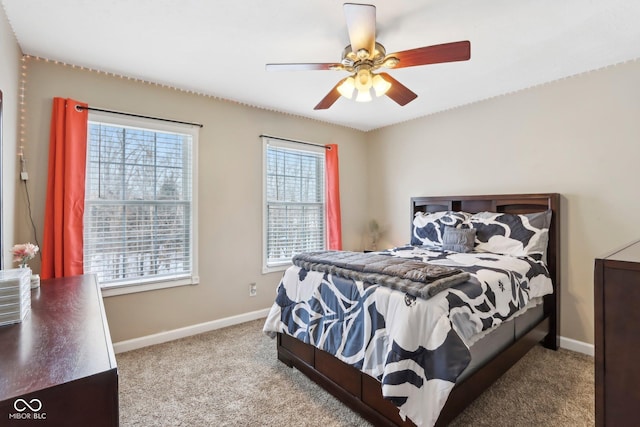 bedroom with carpet flooring, a ceiling fan, and baseboards