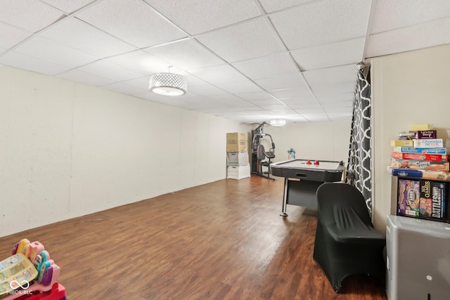 playroom featuring a drop ceiling and wood finished floors