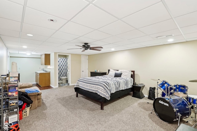 carpeted bedroom featuring recessed lighting, visible vents, baseboards, and a drop ceiling