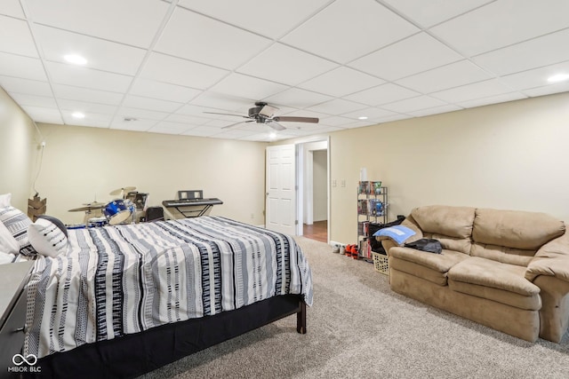 carpeted bedroom featuring a ceiling fan, recessed lighting, and a paneled ceiling