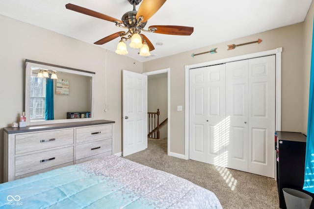 bedroom with a closet, carpet, and ceiling fan