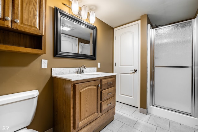 full bath featuring tile patterned flooring, toilet, a stall shower, and vanity