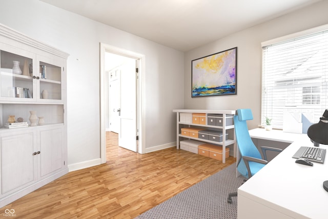 home office with baseboards and light wood finished floors