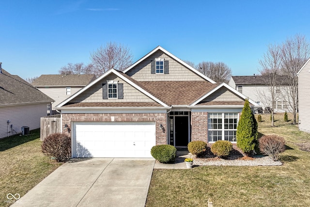 view of front of property featuring a front lawn, concrete driveway, brick siding, and a garage