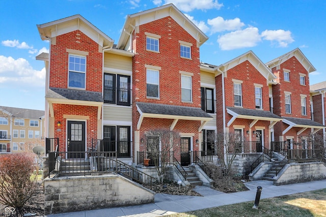 view of property with brick siding