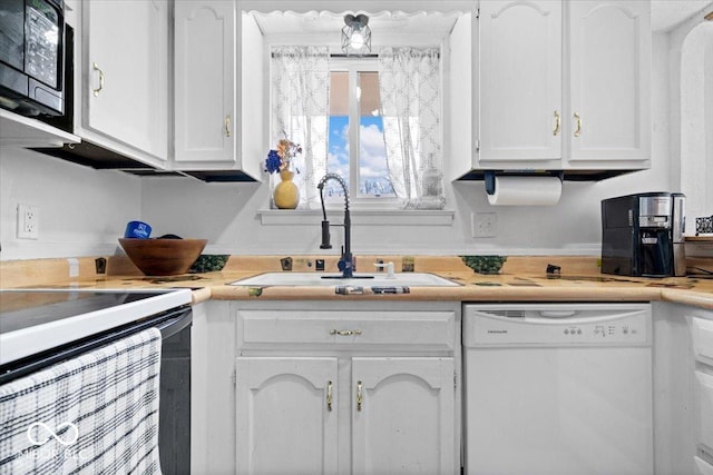 kitchen with dishwasher, white cabinetry, black microwave, and a sink