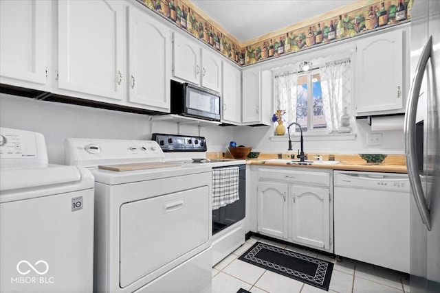 kitchen with black microwave, stainless steel fridge with ice dispenser, dishwasher, range with electric stovetop, and a sink