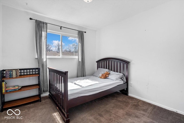 carpeted bedroom with baseboards