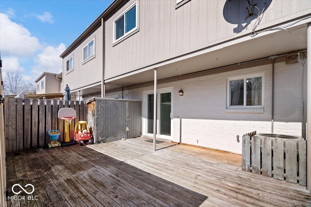 wooden terrace featuring fence