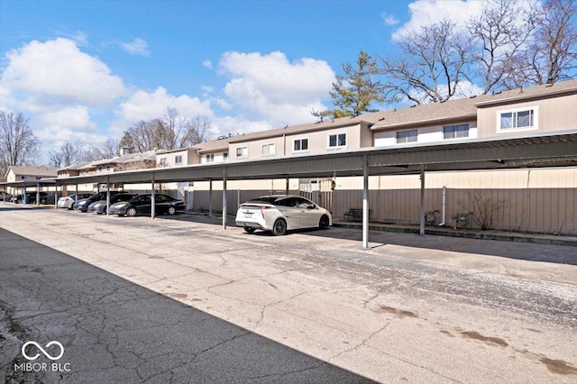 covered parking lot with a residential view