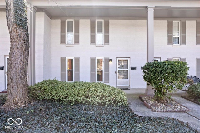 view of front of home featuring brick siding