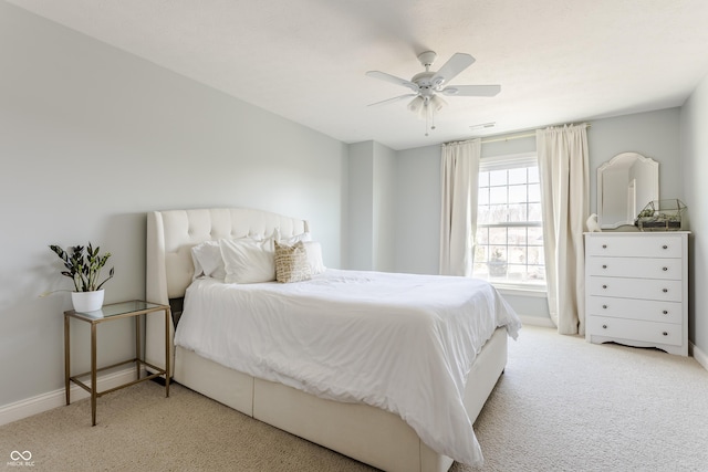 bedroom with carpet flooring, a ceiling fan, and baseboards