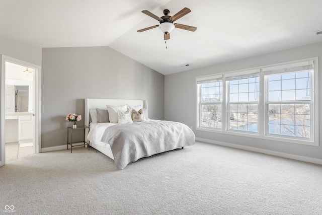 bedroom with visible vents, baseboards, carpet flooring, and vaulted ceiling