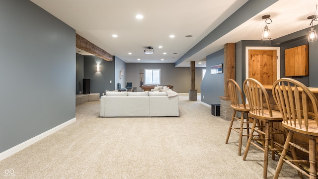 living area with light carpet, recessed lighting, and baseboards