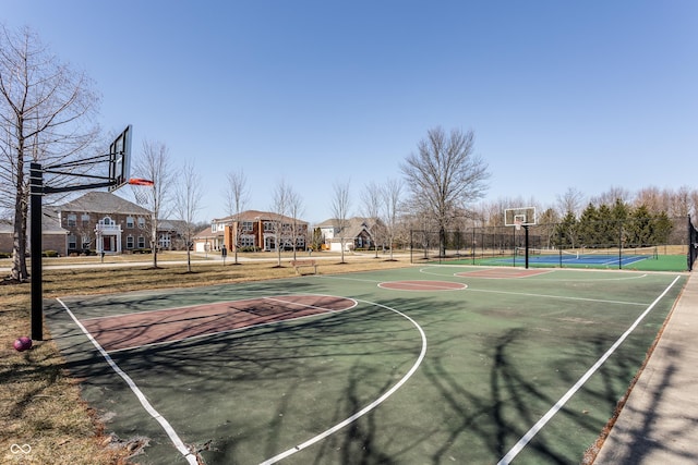 view of sport court featuring community basketball court and fence