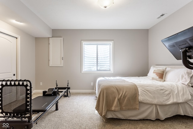 bedroom featuring baseboards, visible vents, and carpet floors