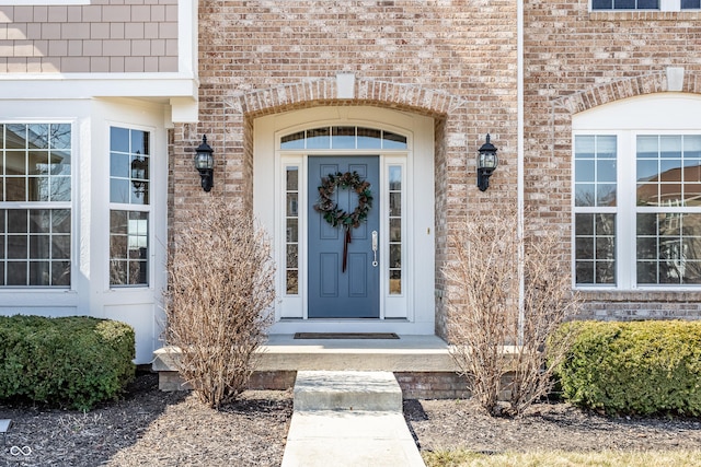 property entrance with brick siding